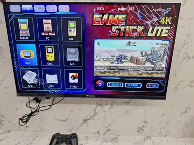 a video game system on a wall with a game stick life at Anderson Zara Homestay in Ipoh