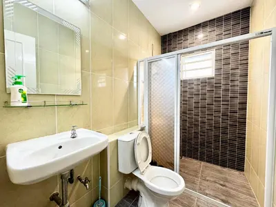 a bathroom with a toilet and a sink and a shower at i Homes Villa 2 at Ipoh Town 16 Guest in Ipoh