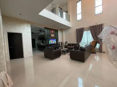 a living room with couches and a tv in it at Bungalow in exclusive area in Nibung Tebal