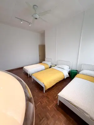 a room with three beds and a ceiling at Canning 48 in Ipoh