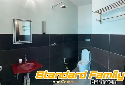a bathroom with a red sink and a toilet at LE dEON HOTEL Former Pine Hotel in Batu Gajah