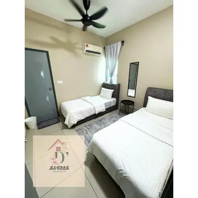 a bedroom with two beds and a ceiling fan at D' Alyssa Homestay Perda in Bukit Mertajam