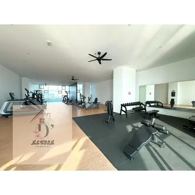 a gym with several exercise bikes and a ceiling fan at D' Alyssa Homestay Perda in Bukit Mertajam