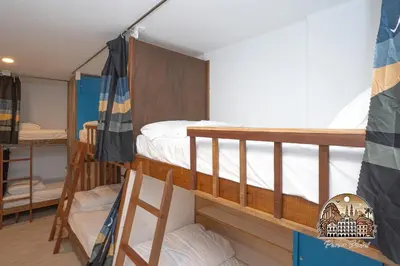 a bunk bed room with two bunk beds at Parlor Hotel in Ipoh