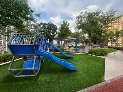 a playground with a blue slide in a park at 3B2R 2CarPark Tea Time Suite with Infinity Pool in Jelutong