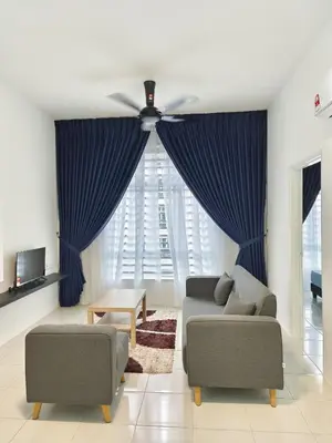 a living room with two couches and a ceiling fan at Dream Anderson Condo in Ipoh
