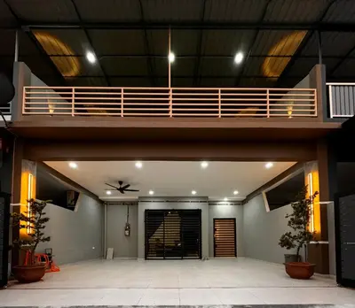arium of a building with a balcony and a staircase at Mia homestay in Teluk Intan