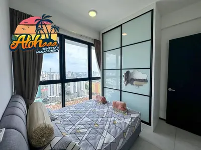 a bedroom with a bed and a large window at Urban Suite Modern Lifestyle Seaview Georgetown in Jelutong