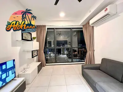 a living room with a couch and a large window at Urban Suite Modern Lifestyle Seaview Georgetown in Jelutong