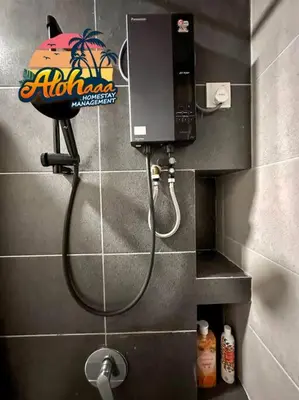 a shower in a bathroom with a phone on the wall at Urban Suite Modern Lifestyle Seaview Georgetown in Jelutong