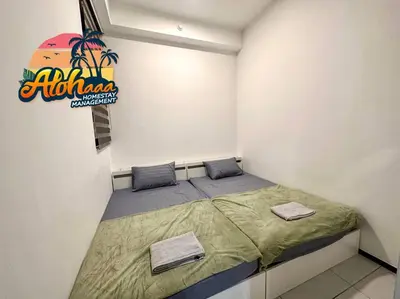 a small bedroom with a bed in a room at Urban Suite Modern Lifestyle Seaview Georgetown in Jelutong