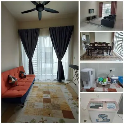 a living room with a couch and a ceiling fan at Rest House Pearl Tropika in Simpang Ampat