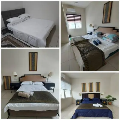 four different pictures of a bedroom with two beds at Rest House Pearl Tropika in Simpang Ampat