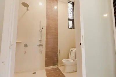a bathroom with a toilet and a shower at Gelugor 2Storey Big Bungalow 23pax with BBQ Snooker in Gelugor