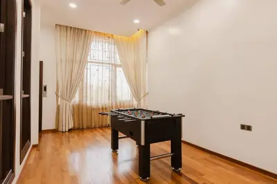 a ping pong table in a room with a window at Gelugor 2Storey Big Bungalow 23pax with BBQ Snooker in Gelugor
