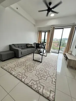 a living room with a couch and a table at Lily Cameron-Tanah Rata in Tanah Rata