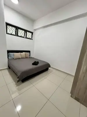 a bedroom with a bed in a white room at Lily Cameron-Tanah Rata in Tanah Rata