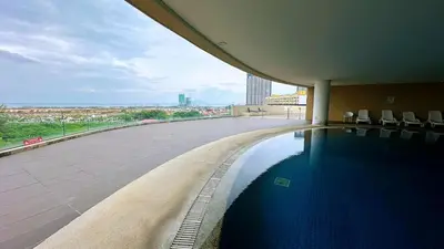 a swimming pool on the roof of a building at 118 Island Plaza ComFy Seaview Suite in Tanjong Tokong