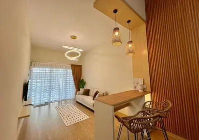 a living room with a table and chairs and a couch at Polo Stay, 4 bedroom Single Storey house Ipoh for 10 pax in Ipoh
