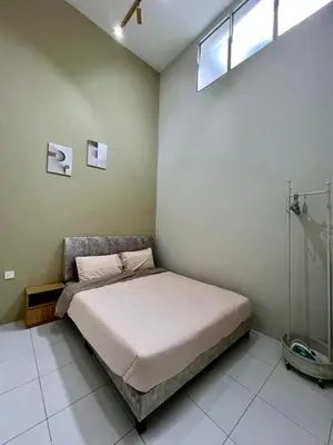 a bedroom with a bed in a room with a window at Polo Stay, 4 bedroom Single Storey house Ipoh for 10 pax in Ipoh