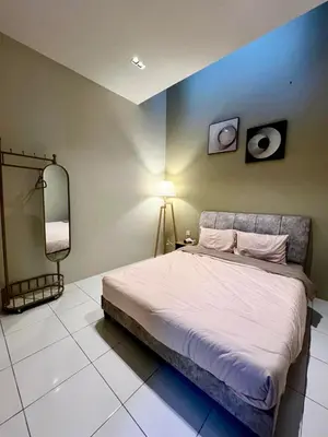 a bedroom with a bed and a blue wall at Polo Stay, 4 bedroom Single Storey house Ipoh for 10 pax in Ipoh