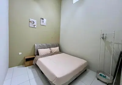 a small bedroom with a bed in a room at Polo Stay, 4 bedroom Single Storey house Ipoh for 10 pax in Ipoh