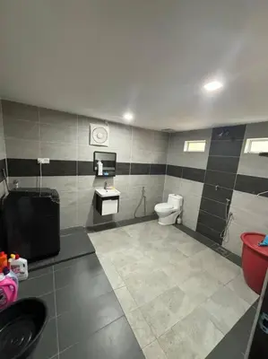 a bathroom with a toilet and a sink and a toilet at Bagan Serai Simpang Empat Parit Buntar Perak by 3SIBS in Bagan Serai