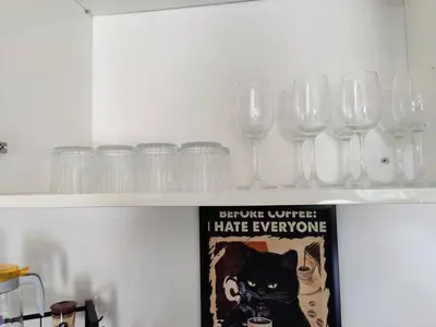 a row of wine glasses on a shelf at #MyLuxeGetaway,Quintet Cameron Highlands in Cameron Highlands