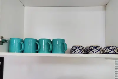 a row of blue cups on a shelf at #MyLuxeGetaway,Quintet Cameron Highlands in Cameron Highlands