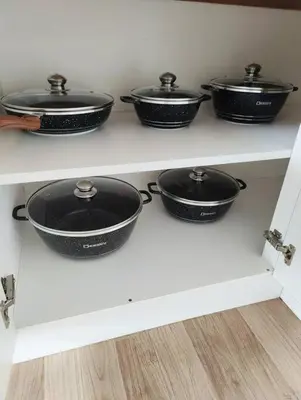a row of pots and pans sitting on a shelf at #MyLuxeGetaway,Quintet Cameron Highlands in Cameron Highlands