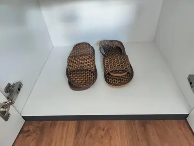 two wicker shoes sitting on a white table at #MyLuxeGetaway,Quintet Cameron Highlands in Cameron Highlands