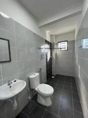 a bathroom with a toilet and a sink at Damai Centaurea Homestay Utp Uitm Seri Iskandar Perak in Seri Iskandar