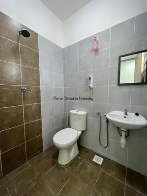 a bathroom with a toilet and a sink at Damai Centaurea Homestay Utp Uitm Seri Iskandar Perak in Seri Iskandar