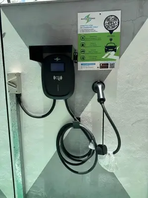 a black toilet with a hose attached to a wall at LM HomeyC 3BR Family Suite for 4-14 Pax with Nexflix & Coway Water Purifier in Tanjong Tokong