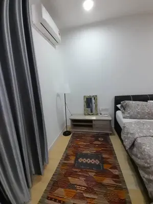 a living room with a couch and a rug at Crystal Heights Cozy House in Tupai