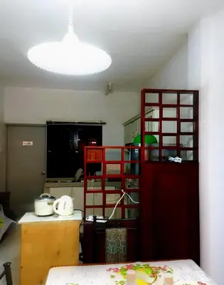 a kitchen with a red door in a room at RF Parkview Residence Homestay in Tanah Rata