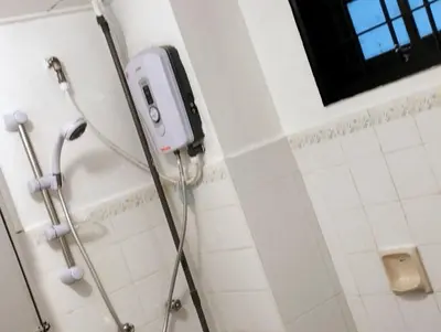 a shower in a bathroom with a phone on the wall at RF Parkview Residence Homestay in Tanah Rata