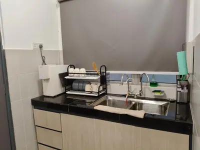 a kitchen with a sink and a counter top at Dream studio Emerald avenue in Cameron Highlands