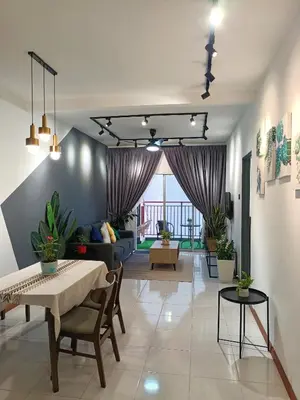 a living room with a table and a couch at Dream studio Emerald avenue in Cameron Highlands