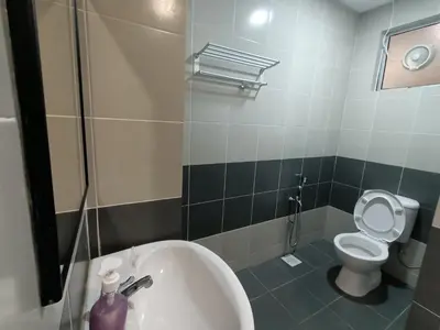 a bathroom with a toilet and a sink and a tub at Dream studio Emerald avenue in Cameron Highlands