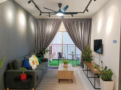 a living room with a couch and a table at Dream studio Emerald avenue in Cameron Highlands