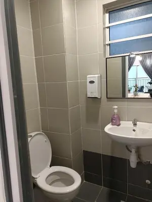 a bathroom with a toilet and a sink at Dream studio Emerald avenue in Cameron Highlands