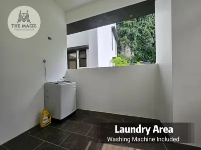 a laundry area with a small refrigerator in a room at The Cove Hillside Residence - Grandiose Oasis in Ipoh