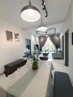 a living room with a dining table and a living room at Dream 6 Emerald avenue in Cameron Highlands