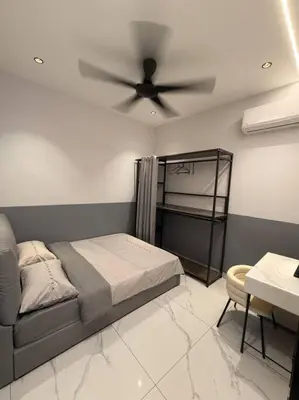a bedroom with a bed and a ceiling fan at Live Like Your Home, Alma Bukit Mertajam in Bukit Mertajam