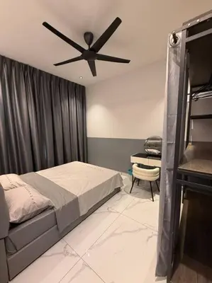 a bedroom with a bed and a ceiling fan at Live Like Your Home, Alma Bukit Mertajam in Bukit Mertajam