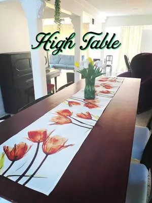 a table with a table cloth with flowers on it at Bergstein Taiping in Taiping