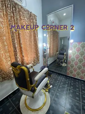 a hair salon with a chair and a mirror at Bergstein Taiping in Taiping