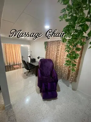 a purple chair sitting in a room with a desk at Bergstein Taiping in Taiping