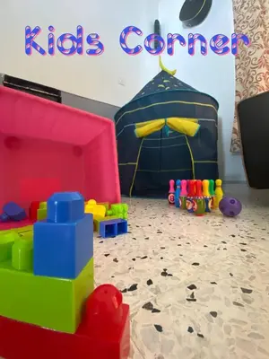 a room with a kids corner with a tent and toys at Bergstein Taiping in Taiping